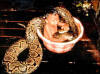 Boy bathing with large snake